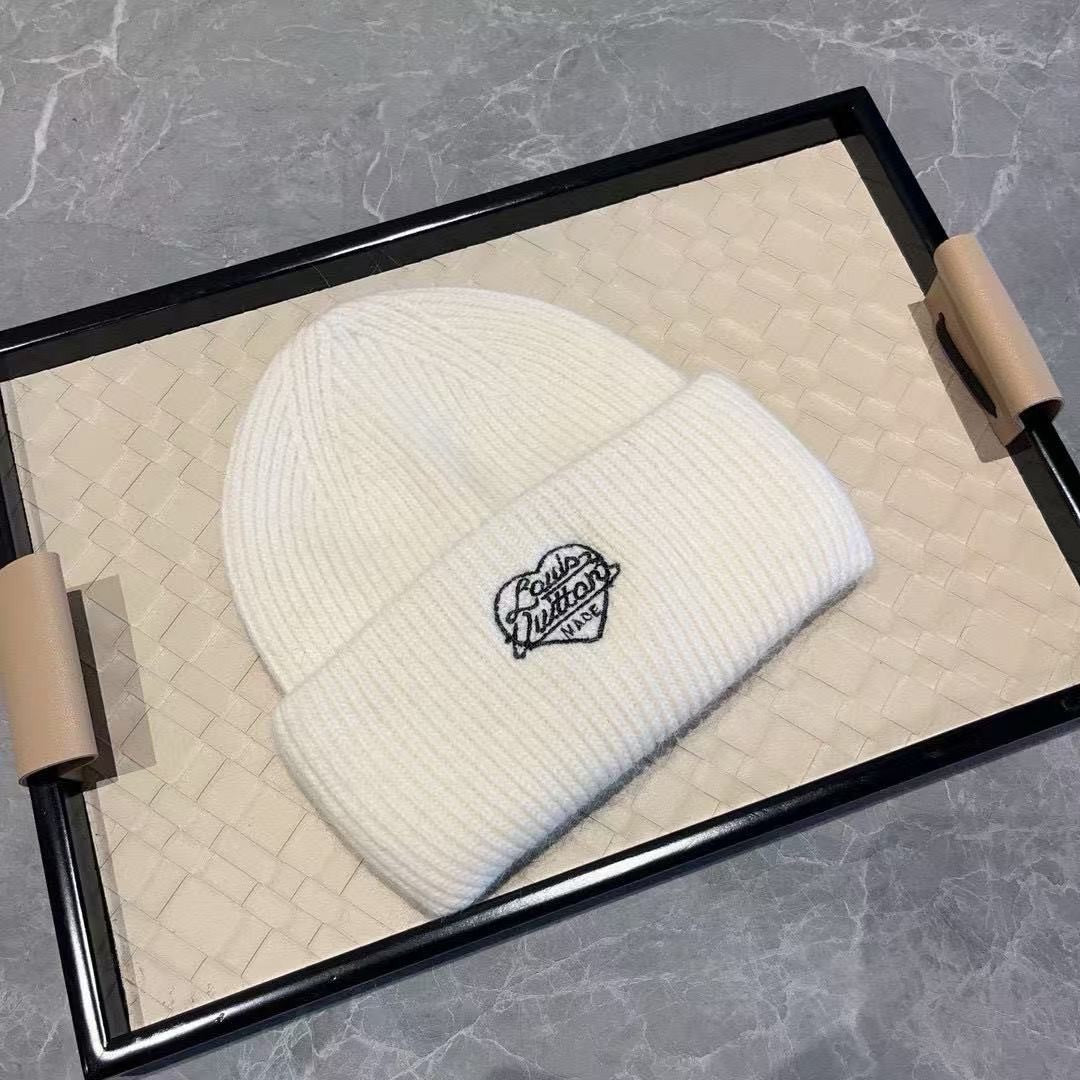 Unisex mohair winter beanie with a heart-shaped embroidery and a folded cuff
